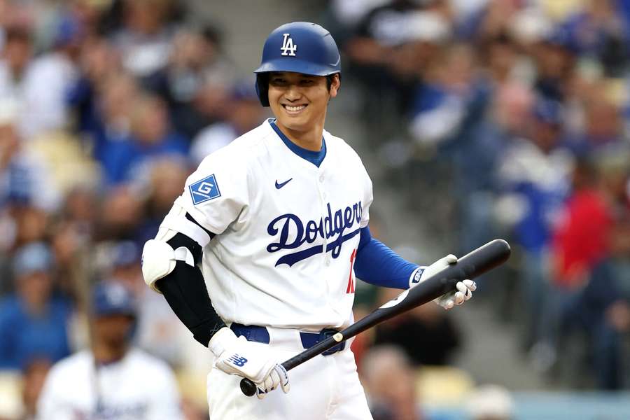 Shohei Ohtani smiling as he walks up to the batter's box (2025)