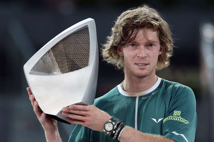 Russia's Andrey Rublev holds his trophy after winning the 2024 ATP Tour Madrid Open tournament 