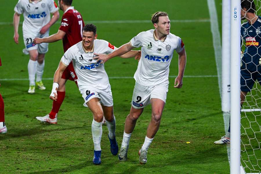 Auckland FC's Sam Cosgrove celebrates the penalty goal that put Auckland up 3-0. 