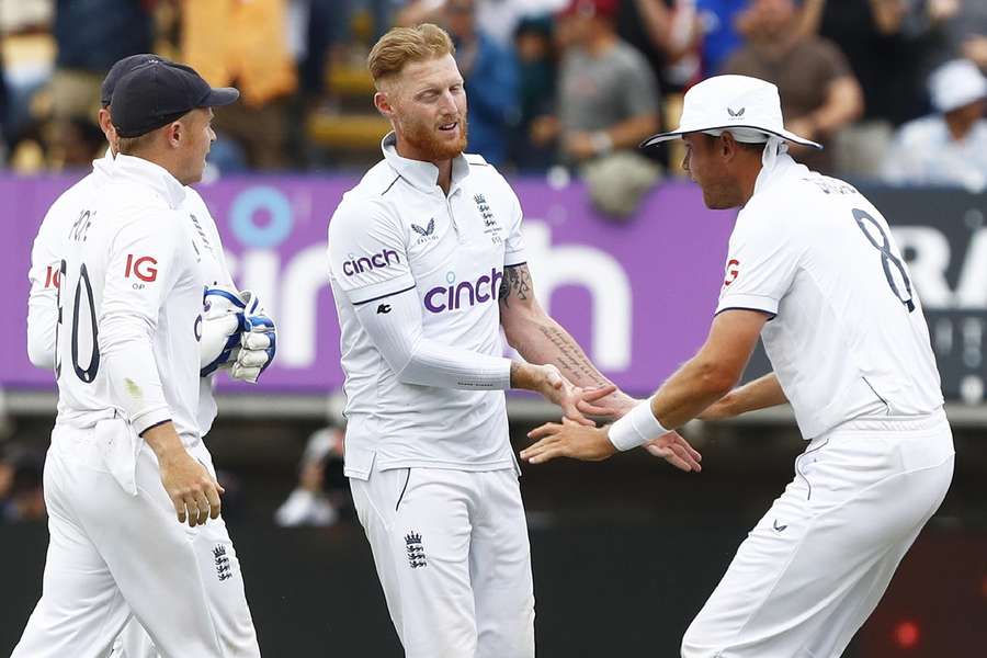 England celebrate the wicket of Khawaja