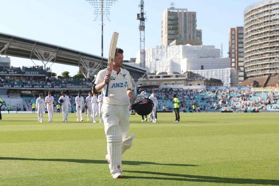 Henry Nicholls walks off the pitch at the end of the day