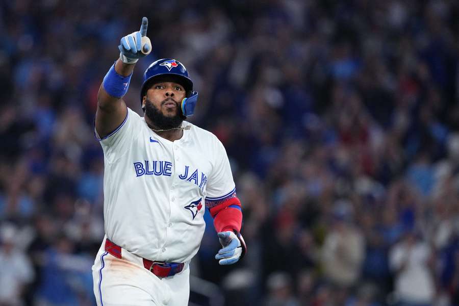 Blue Jays' Vladimir Guerrero Jr. reacts after hitting a home run in Game 6 of the 2025 ALCS