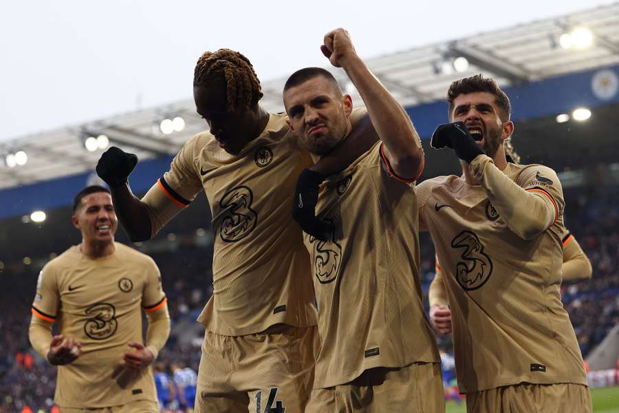 Chelsea's Croatian midfielder Mateo Kovacic (2R) celebrates scoring the team's third goal with English defender Trevoh Chalobah (2L) 