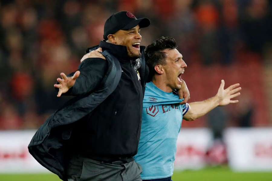 Vincent Kompany celebrates with Jack Cork