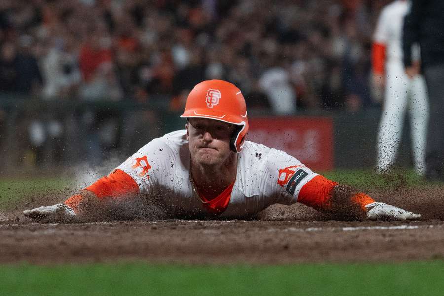 San Francisco Giants shortstop Tyler Fitzgerald slides into home plate to defeat the Philadelphia Phillies