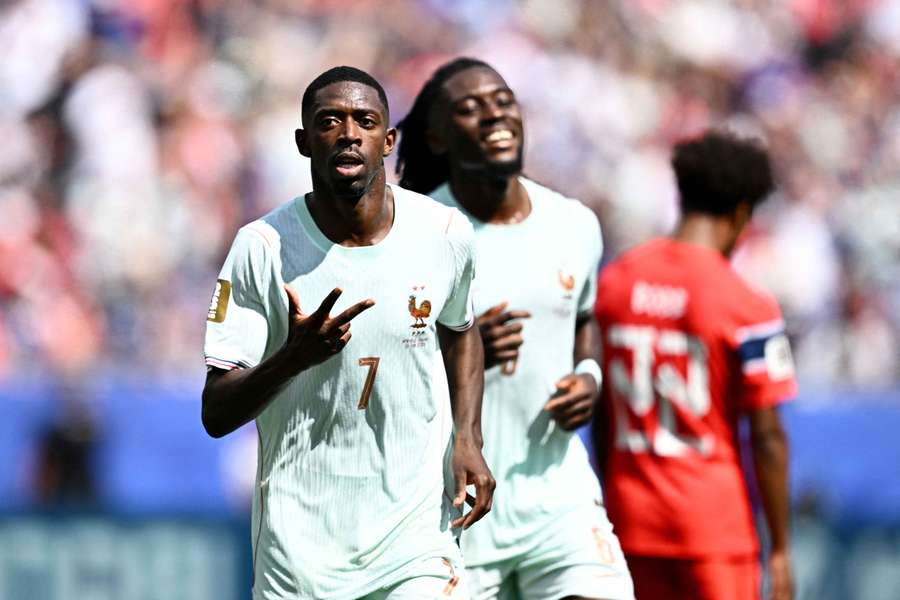 Ousmane Dembélé celebrates scoring his hat-trick