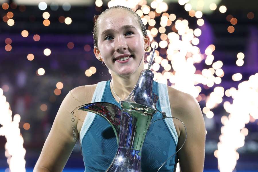 Mirra Andreeva celebrates with the trophy in Dubai Mirra Andreeva celebrates with the trophy in Dubai