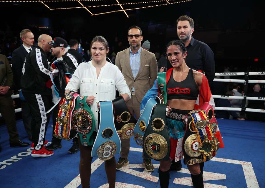 Amanda Serrano and Katie Taylor pose in the ring