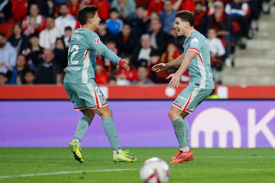 Alvarez celebrates his winner with Giuliano Simeone