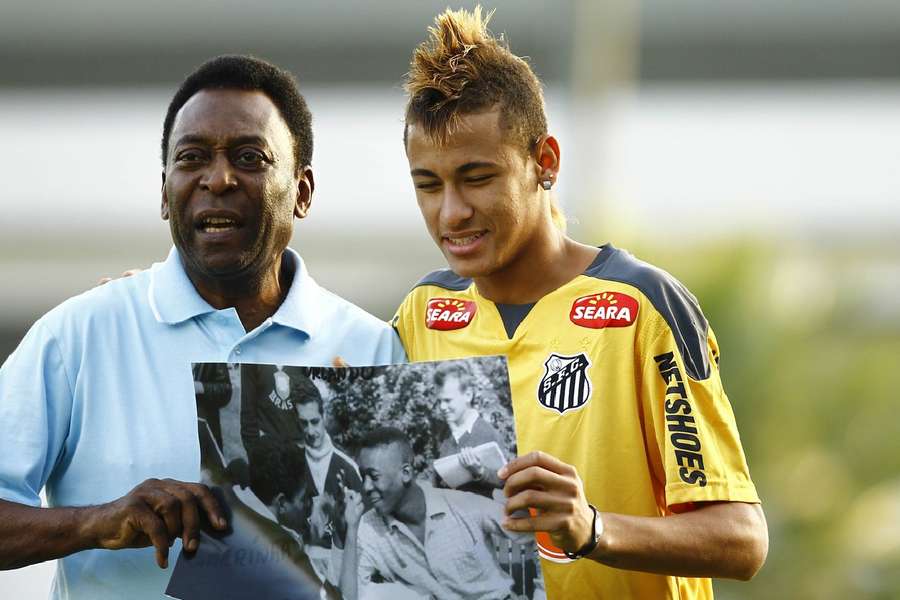 Neymar taking a picture with Pele during his Santos days