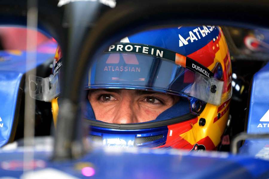 Carlos Sainz in his car in the Williams garage