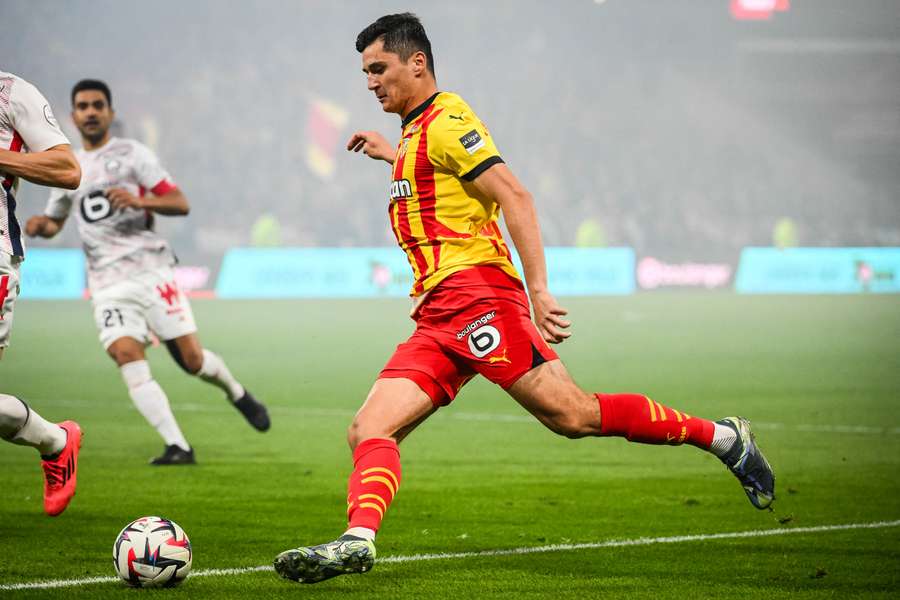 Khusanov during the derby against Lille last October.