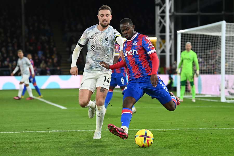 Liverpool's English midfielder Jordan Henderson vies with Crystal Palace's English defender Tyrick Mitchell 