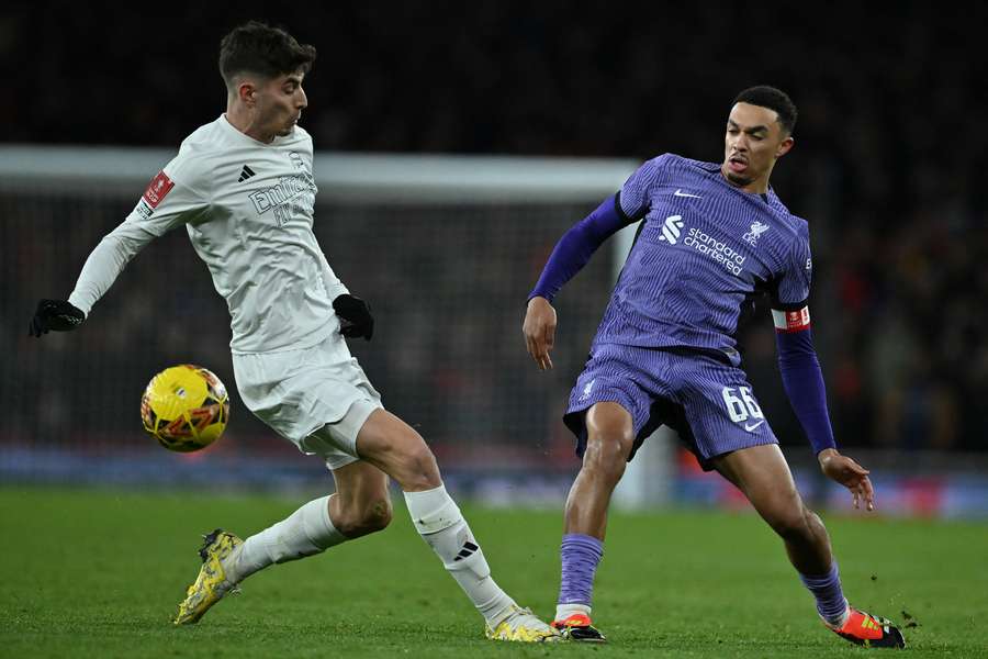 Kai Havertz (L) vies with Liverpool's English defender #66 Trent Alexander-Arnold (R) 