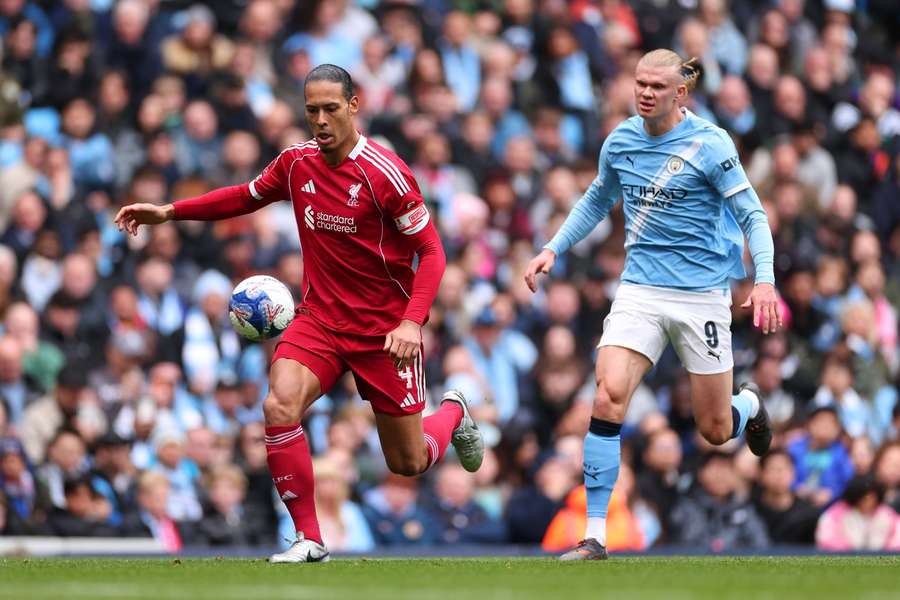 Liverpool's Virgil van Dijk in action against Man City's Erling Haaland