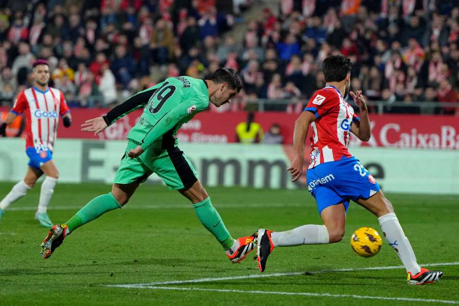 Alvaro Morata, left, scored three for Atleti as they came up short against Girona