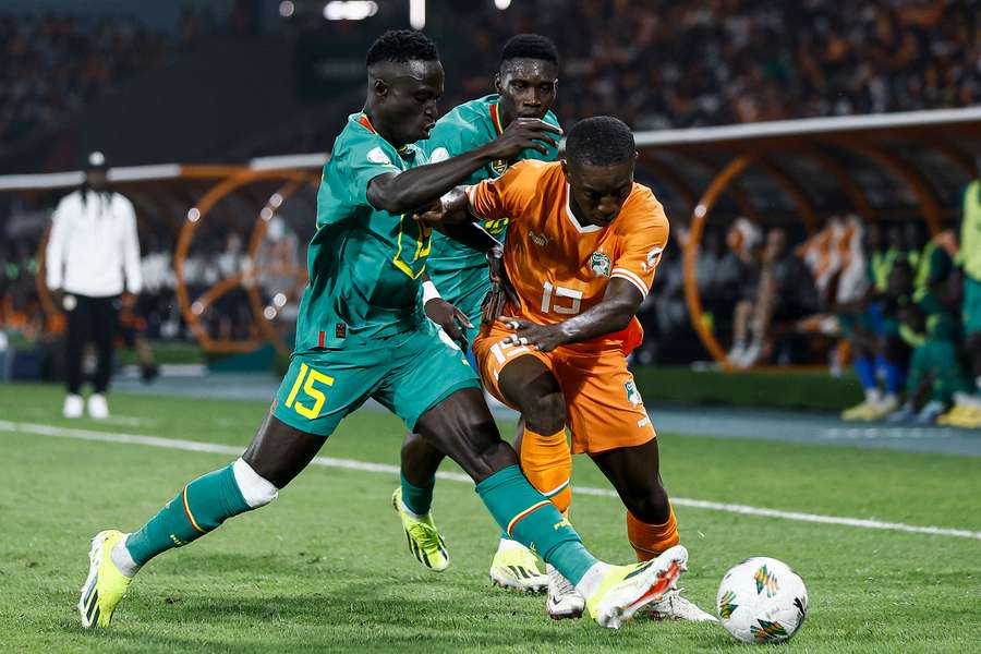 Senegal's Krepin Diatta (L) challenges Max-Alain Gradel of Ivory Coast during Monday's Africa Cup of Nations last-16 tie
