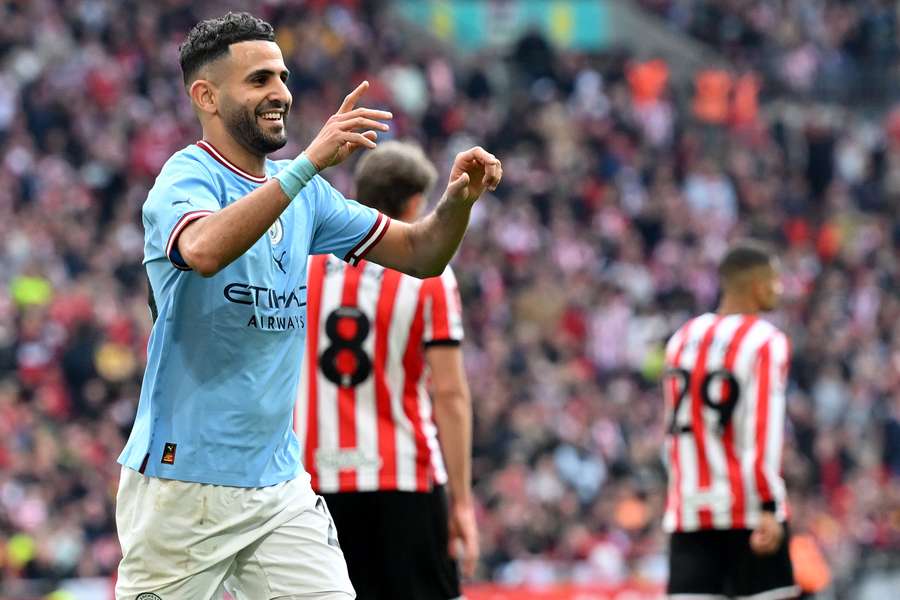 Manchester City's Algerian midfielder Riyad Mahrez celebrates scoring the team's third goal