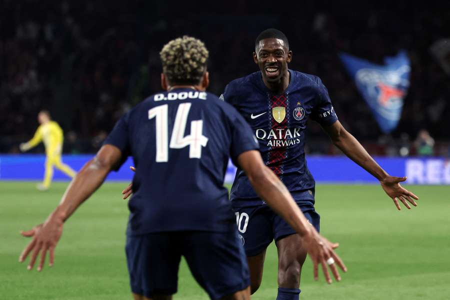 Dembele celebrates his goal with teammate Doue