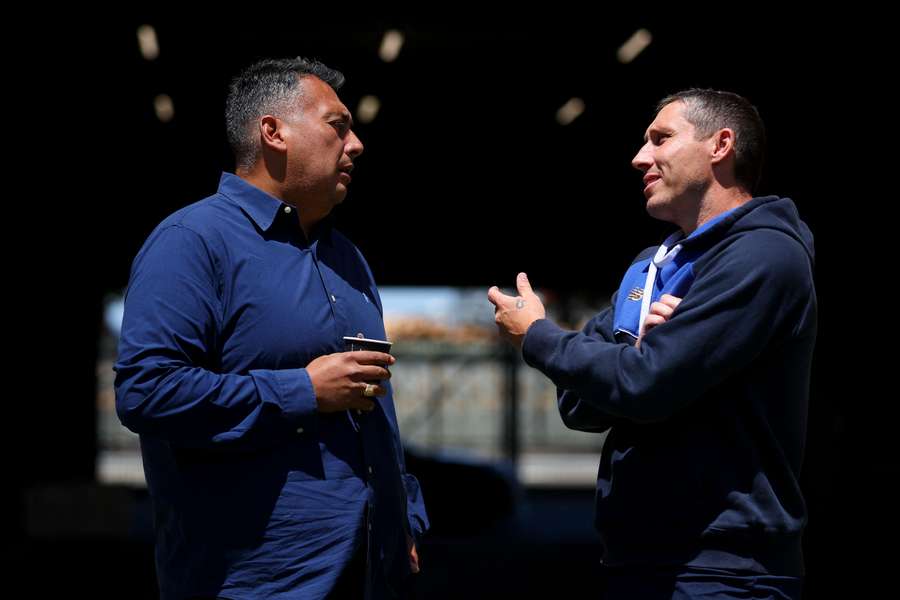 Giancarlo Italiano and Mark Milligan chat before going to battle at Sky Stadium on Sunday.