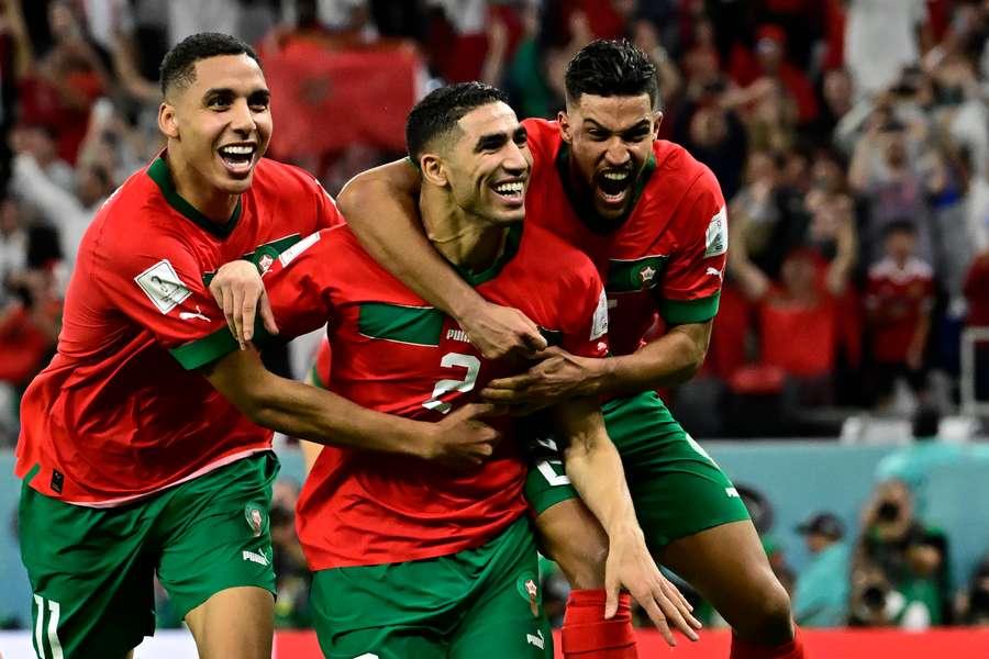 Hakimi (C) celebrates scoring the winning penalty against Spain