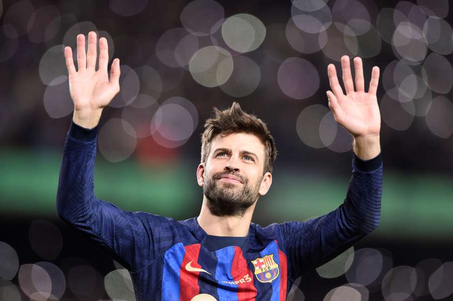 Barcelona's Spanish defender Gerard Pique waves to fans after his final home match