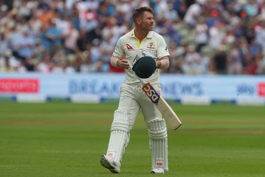 Australia's David Warner reacts as he walks back to the pavilion after losing his wicket for 9 runs