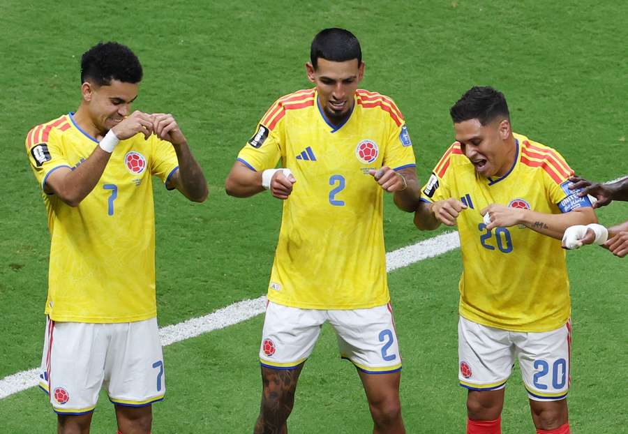 Daniel Munoz celebrates with teammates