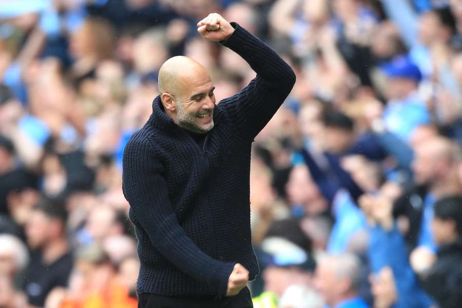 Manchester City's Spanish manager Pep Guardiola celebrates after his team's first goal