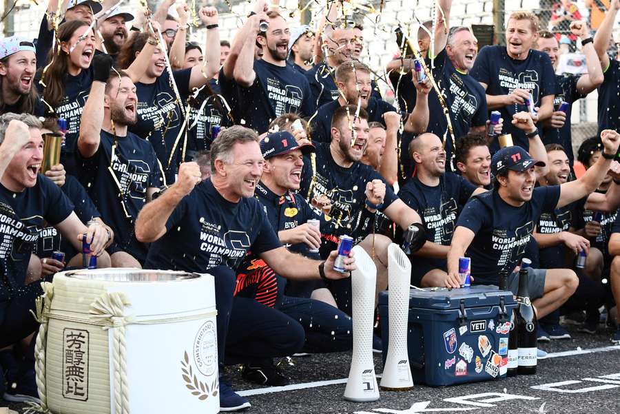 Red Bull's Max Verstappen, team principal Christian Horner, Sergio Perez and team members celebrate winning the Formula 1 constructors' championship