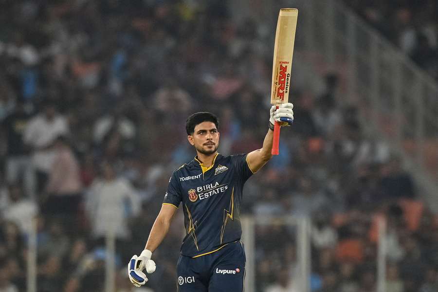 Gujarat Titans' Shubman Gill celebrates after scoring a half-century against Kolkata