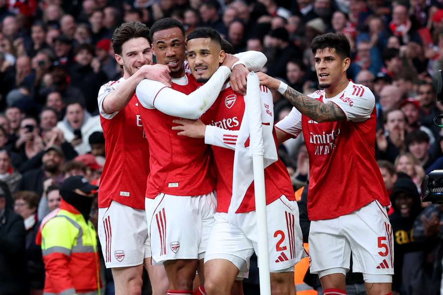 Arsenal's William Saliba celebrates scoring their first goal with Gabriel Magalhaes, Declan Rice and Piero Hincapie