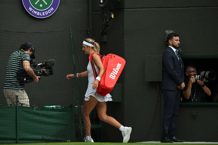 Belarus' Victoria Azarenka leaves after being beaten by Ukraine's Elina Svitolina