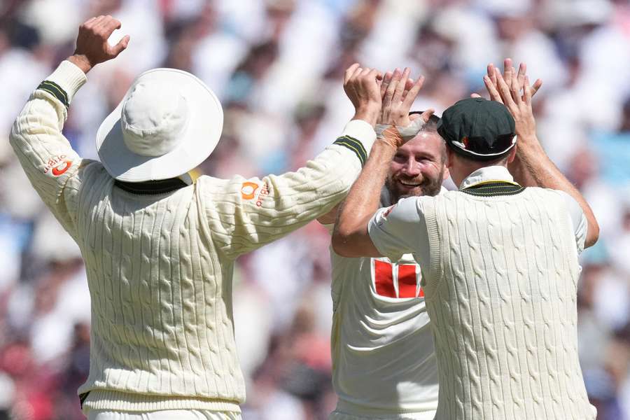 Australia's Michael Neser celebrates after getting the wicket of England's Joe Root