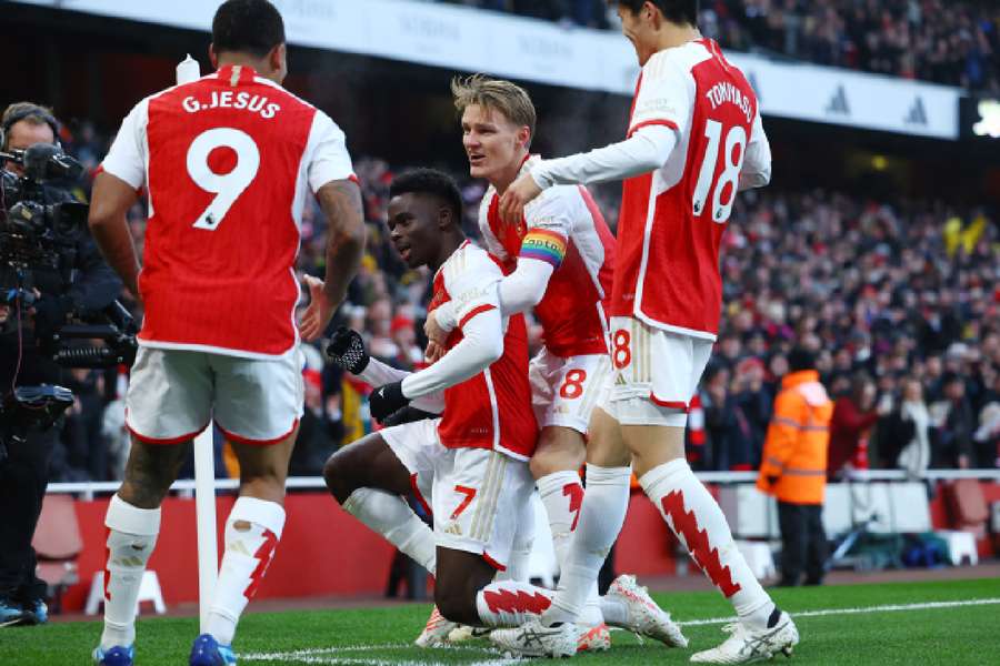 Arsenal celebrate scoring against Wolves