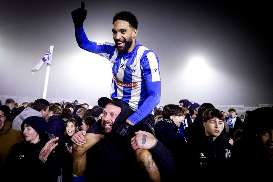 Quick Boys forward Ravelino Junte celebrates the cup win over sc Heerenveen on the shoulders of a fan