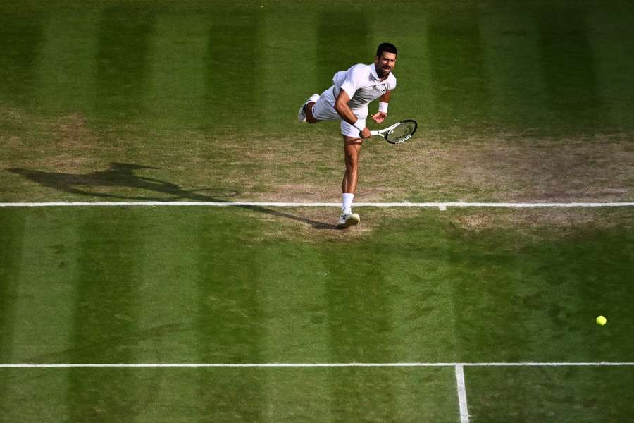 Serbia's Novak Djokovic serves against Spain's Carlos Alcaraz during their men's singles final