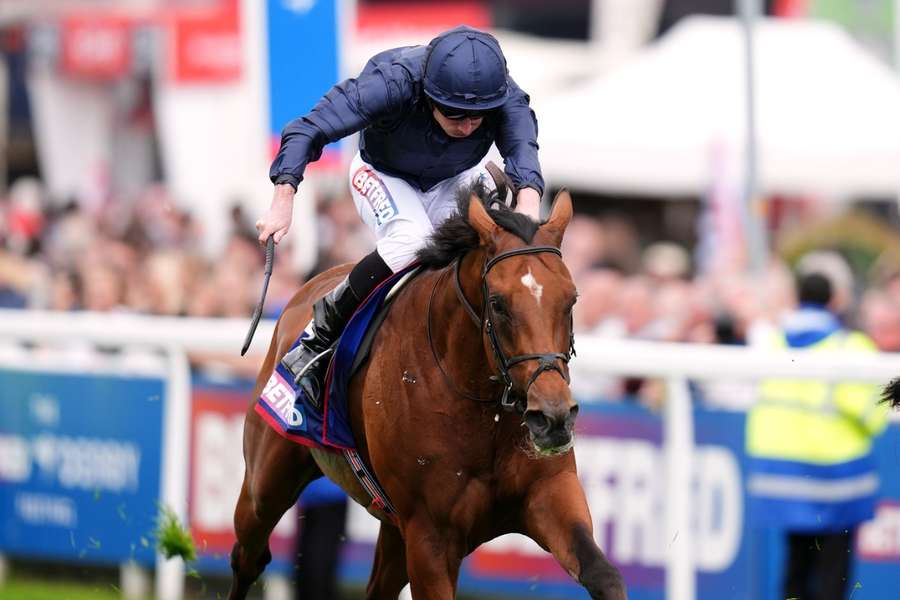 City Of Troy ridden by Ryan Moore on their way to winning the Betfred Derby