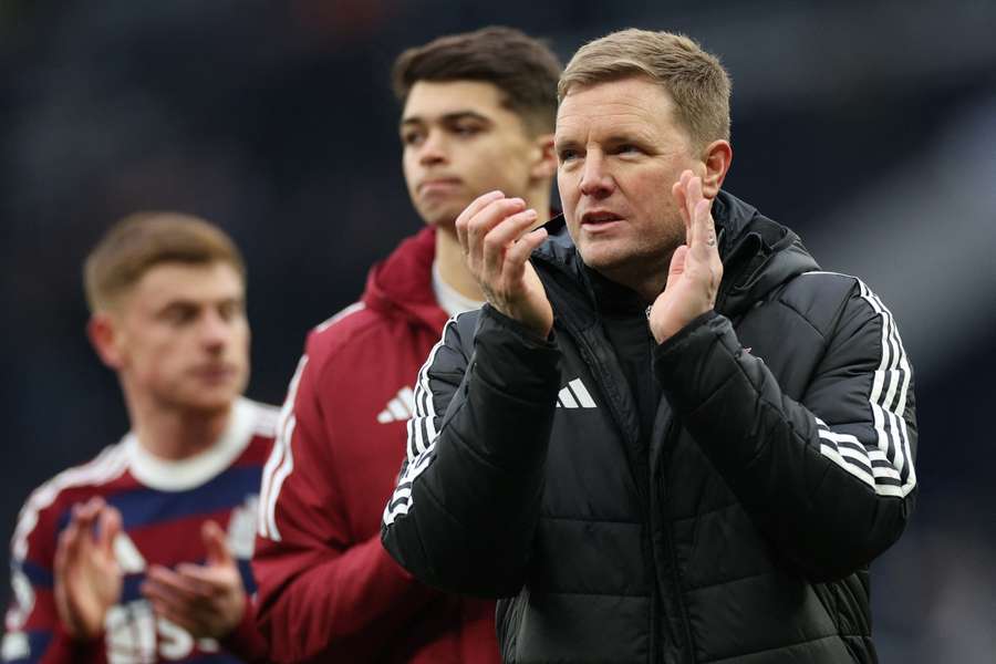 Eddie Howe applauds fans on the pitch after the match between Tottenham Hotspur and Newcastle United