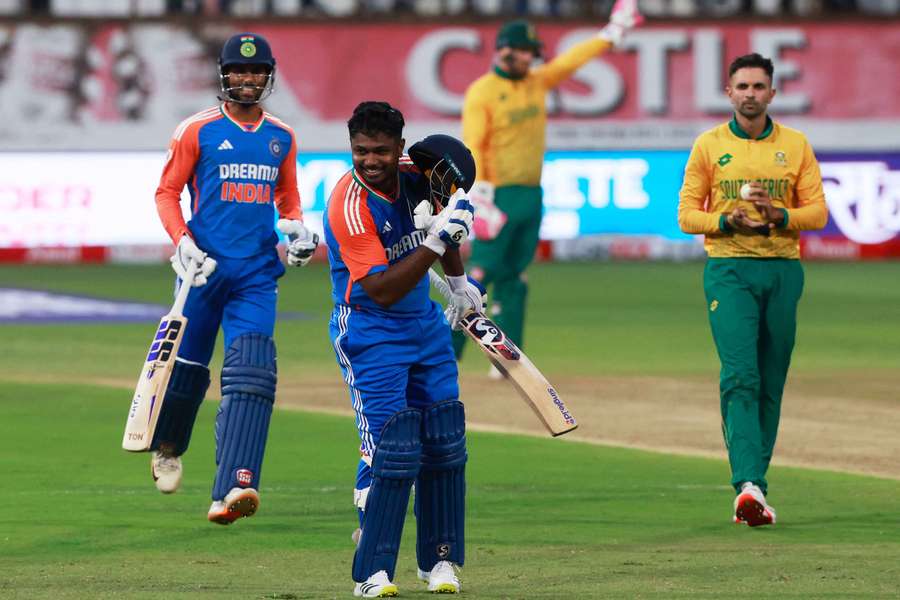 India's Sanju Samson celebrates after reaching his century