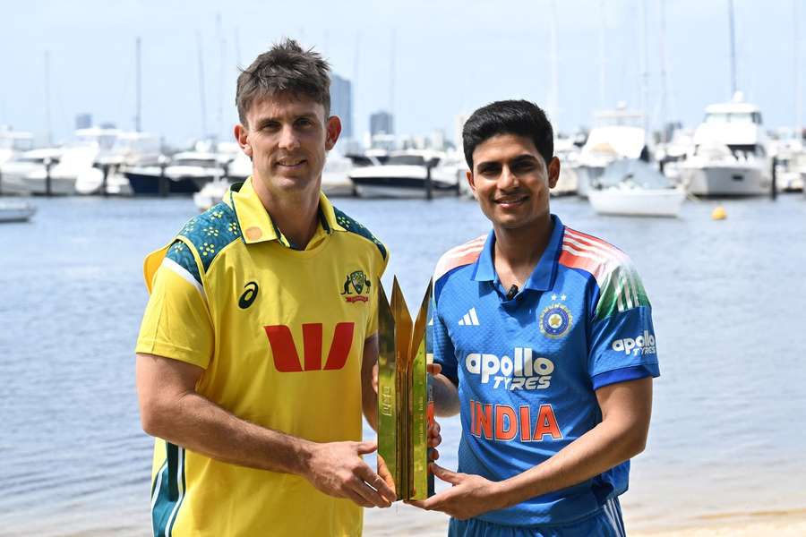 Shubman Gill (R) alongside Australia captain Mitchell Marsh