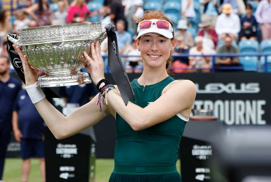 Joint celebrates with her trophy