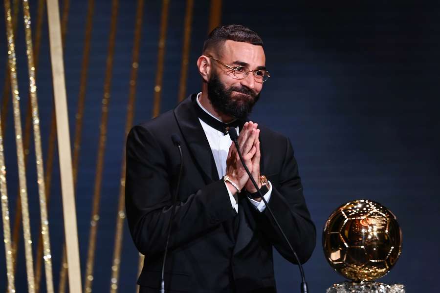 Real Madrid's French forward Karim Benzema receives the 2022 Ballon d'Or award