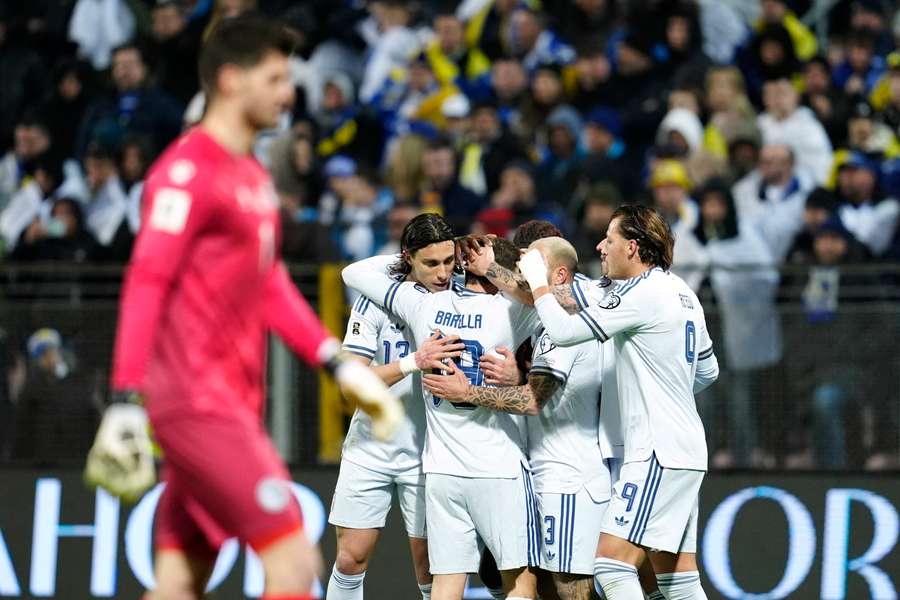 Italy celebrate their opener
