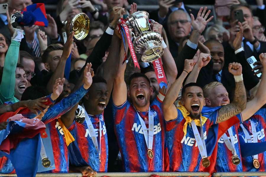 Crystal Palace's players celebrate with the FA Cup trophy