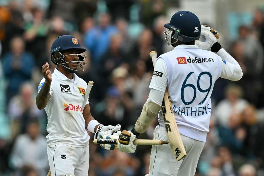 Sri Lanka's Pathum Nissanka (L) and Sri Lanka's Angelo Mathews celebrate