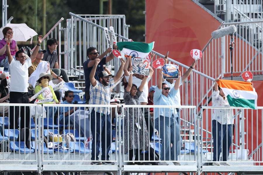 Indian supporters cheering on players at the Asian Games in Japan. Indian supporters cheering on players at the Asian Games in Japan.