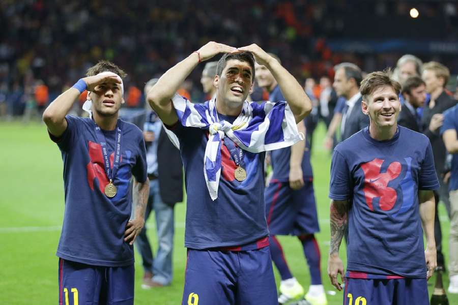 Messi, Suarez and Neymar celebrate their Champions League win