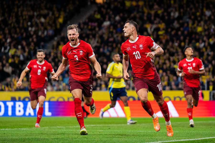Granit Xhaka (right) celebrates his penalty