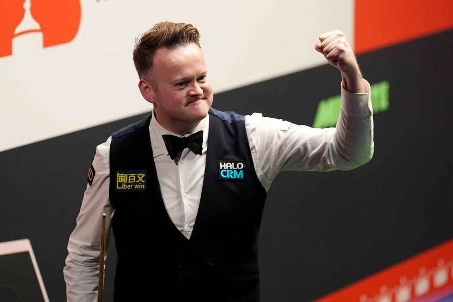 Shaun Murphy celebrates his victory at the Crucible